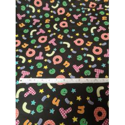 Black alphabet cotton with bright letters fabric.jpg