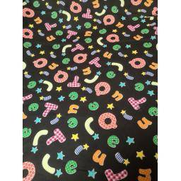 Black alphabet cotton with bright letters fabric.jpg